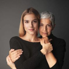 an older woman hugging her younger lady in front of a gray background with the text, how do you know about aging?