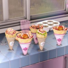 there are many ice cream cones on the counter