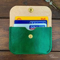 This minimalist leather wallet is a useful accessory, perfect for containing your cards and coins.  Made from the highest quality leather in either a warm gingerbread, pure black, emerald green, honeycomb yellow or indigo blue colour, this leather pocket has been lovingly handcrafted and would make an excellent Mother's Day or Father's Day gift. The natural grain and dye of the leather makes each piece unique. Personalise with the name or message of your choice (10 characters max). The message will be stamped on the front of the wallet. Green Leather Card Holder For Everyday Use, Everyday Green Coin Purse With Card Slots, Everyday Green Coin Purse, Bifold Coin Purse With Card Slots For Everyday Use, Everyday Bifold Coin Purse With Card Slots, Everyday Green Wallet With Coin Pocket, Everyday Green Coin Purse With Coin Pocket, Green Leather Coin Purse With Card Slots, Green Leather Coin Purse For Everyday