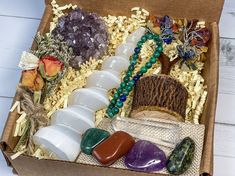 a box filled with lots of different types of rocks and stones on top of each other