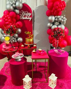 a pink and silver birthday party with balloons