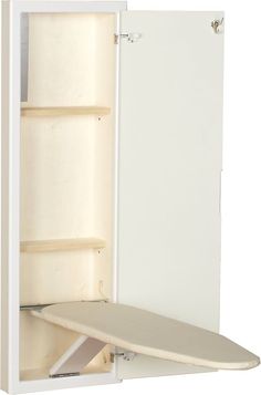 an open white cabinet with a surfboard in it