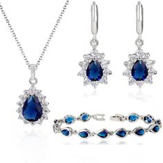 PRICES MAY VARY. LOOK LIKE A PRINCESS WITH YOUR BLUE EARRINGS: Indulge yourself in the Crystalline Azuria premium jewelry set for women and impress everyone with your sapphire blue color 18K gold plated earrings! MAKE ALL HEADS TURN WITH YOUR TIMELESS NECKLACE: Match your earrings with your classy cubic zirconia necklace and pendant set and make a fashion statement on your prom or wedding night. GRAB EVERYONE'S ATTENTION WITH YOUR CHIC BRACELET: Tie the royal look together with the 18K white gol Costume Jewelry Sets, Chic Bracelet, Women's Jewelry Sets, Matching Jewelry, Gold Plated Bracelets, Crystal Necklace Pendant, Wedding Jewelry Sets