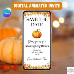 save the date card with pumpkins and fall leaves on wooden table in front of blurry background