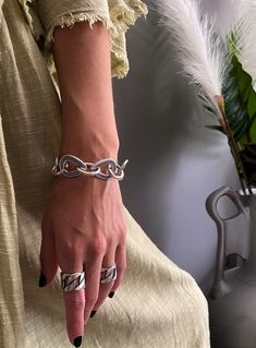 "Silver plated large links bracelet, thick oval drop links bracelet, unique modern rock chain bracelet, chunky statement bracelet, gift idea Welcome to my shop! 📌Please Kindly Note: The listing is for only one bracelet!! 📌It is made of Brass, which has been immersed in 999o sterling silver twice! 📌It is subjected to an anti-allergic process (nickel and lead-free). 📌It has a good weight on it. 📌The chain is made of solid and sturdy links. 📌Many of our jewelry has been through an oxidation process. Therefore, some natural black marks or imperfections on production may occur for a more obvious vintage-aged tone but oxidation naturally wears off over time. 📏MEASUREMENTS: *Bracelet's total length: 8'' ( 20.32cm) *Bracelet's width: 0.78'' (2cm) OVAL LINK DIMENSIONS: *Width: 0.11'' (0.3cm) Bracelet Thick, Modern Rock, Matching Rings, Statement Bracelet, Chain Ring, Chain Link Bracelet, Bracelet Gift, Link Bracelets, Chain Bracelet