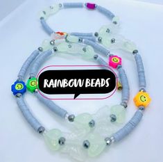 an image of a necklace with beads on it that says rainbow bead bracelets