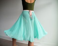 "MERMAID SKIRT Available in 2 Styles: Kat Skirt - Wrap Skirt Juliet Skirt - Elastic Waist SWEET & SUMMERY! This beautiful bright seafoam rehearsal skirt is made of our diaphanous crêpe chiffon fabric. It creates a flattering line and is an essential for every dancer's wardrobe! SKIRT SIZING: Small Length - 24\" or 26\" Waist - Fits 20\"-30\" Medium Length - 24\" or 26\" Waist - Fits 28-38\" *pictures in the Juliet style" Beach Flared Stretch Skirt, Beach Stretch Flared Skirt, Green Fitted Tiered Skirt, Green Stretch Flared Skirt, Summer Dance Skirt, Fitted Flared Beach Skirt, Fitted Flared Wrap Skirt For Beach, Fitted Green Gathered Skirt, Fitted Green Gathered Skirt Bottoms