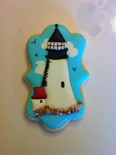 a cookie shaped like a lighthouse on top of a table