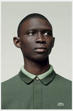 a young man in a green polo shirt