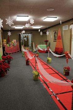 an office decorated for christmas with red and green decorations