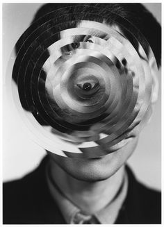 a man's head with multiple circles in the middle