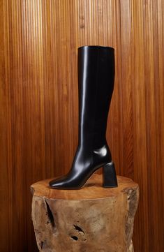 A slightly flared block heel perfects the profile of a streamlined boot shaped from smooth Italian leather. 3" heel Side zip closure Leather upper, lining and sole Made in Italy Sleek Knee-high Boots With Stacked Heel And Square Toe, Wide Calf Boots With Sculpted Heel And Square Toe, Office Boots With Stacked Heel And Medium Width, Sleek Wide Calf Boots With Stacked Heel, Sleek Square Toe Heeled Boots For Work, Sleek Square Toe Heeled Boots For Business, Sleek Business Heeled Boots With Square Toe, Classic Wide Calf Boots With Block Heel, Calf Leather Boots With Block Heel