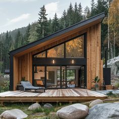 a wooden deck leading to a house in the woods