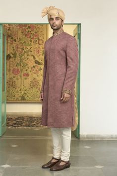 Blush pink sherwani with all over woven paisley patterns and sequin embellishments. Comes with inner kurta and churidar. - Aza Fashions Fitted Pink Sherwani With Pallu, Designer Pink Kurta With Naqshi Details, Festive Pink Kurta With Naqshi Details, Fitted Pink Sherwani With Cutdana, Pink Fitted Sherwani With Cutdana, Festive Pink Formal Traditional Wear, Formal Pink Kurta With Dabka Details, Pink Naqshi Kurta For Festive Occasions, Fitted Pink Sherwani With Dabka Details