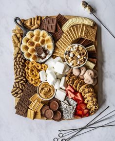 a platter filled with lots of different types of food on top of a table