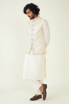 Ivory bundi adorned with intricate gota-patti jaal pattern embroidery. - Aza Fashions Off White Naqshi Nehru Jacket For Eid, Off White Nehru Jacket With Naqshi For Eid, Festive White Nehru Jacket With Naqshi Detailing, Festive White Nehru Jacket With Naqshi, Traditional Off White Nehru Jacket With Naqshi, Cream Nehru Jacket With Zari Work For Eid, White Nehru Jacket With Naqshi For Diwali, Eid Cream Nehru Jacket With Zari Work, Transitional White Raw Silk Nehru Jacket