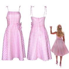 two dolls dressed in pink and white checkered dresses, one is holding the other's hand