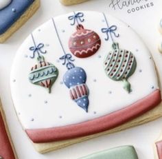 decorated cookies are displayed on a white surface