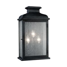 an outdoor light fixture with three lights on it