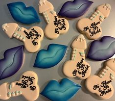 decorated cookies with blue and white frosting on a table