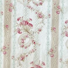 an old fashioned wallpaper with pink flowers on white and green stripes in the background