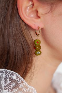 Introducing our Martini Olive earrings! Featuring our brand new Olive charm! <3  Every picnic blanket piece is lovingly designed and handcrafted completely in-house and perfectly finished in our jewellery studio.  Every individual glass feature charm takes around half an hour to delicately form by hand in the flame, reaching temperatures of up to 800 degrees celsius, before heading to the kiln to soak for around 8 hours in the warmth to ensure strength and longevity. The charms are then washed b Handmade Czech Glass Hoop Earrings Gift, Handmade Czech Glass Jewelry For Everyday, Handmade Green 14k Gold Filled Earrings, Handmade Czech Glass Everyday Jewelry, Handmade Everyday Czech Glass Jewelry, Olive Earrings, Olive Jewelry, Martini Olive, Martini Olives