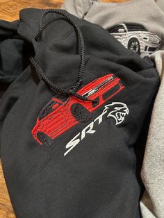 This Hoodie Is From Algo Melhor's Season 4 Drop. Prices Increase After the Drop Has Finished. For Next Seasons Drop Please Follow Our Instagram/Tik Tok @algomelhorapparel. Hell Cat Embroidered Hoodie CHOOSE YOUR COLOR CAR ON THE PERSONALIZATION SECTION ✅ALL ITEMS ARE MADE TO ORDER (shipping times can vary from 1 week to 3-4 weeks. I am one individual doing this, please understand.  🧵 All Items Are Custom Made By Me Unless Stated Otherwise.  📲 Please Feel Free to Message Me If You Have Any Ques Hoodie Design Embroidery, Red Hooded Hoodie With Embroidered Graphics, Red Embroidered Hooded Hoodie, Red Embroidered Graphic Hoodie, Car Hoodies, Car Sweatshirt, Car Hoodie, Hell Cat, Srt Demon