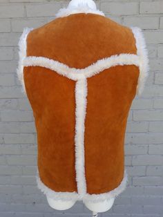 Suede and shearling sherpa vest by PYPSA. This fabulous brown vest features super cozy sheepskin lining. It also has 2 buckle clip closures and two front waist pockets. Made in MexicoTag reads 38, this is best suited to a small, possibly medium.Measurements taken with vest laying flat:Length 26"Bust 38"Waist 38"Vest is in great vintage condition. The only issue is that it needs to be professionally cleaned. There is a pen mark on the front of vest. Other than that, no major staining but it is on Flora Nikrooz, Sherpa Vest, Brown Vest, Corpus Christi Tx, Lace Nightgown, Fabulous Fabrics, Cream Lace, Vintage Tops, Womens Vest