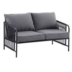 a gray couch with two pillows on it's back and one arm in the middle