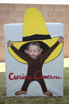 a child's costume made to look like a monkey with a hat on his head