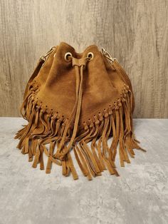 Soft Italian Real Suede Leather Brown Fringe Tassel Crossbody Bag/ Suede Leather Tan Shoulder bag Fringe bags/ Brown Suede Bags Gifts for her Drawstring Closure Internal zipped pocket  Gold tone metal hardware  Detachable /Adjustable strap Fully lined inside  Soft Italian Real Suede Leather  Dimensions: H25cm x L25cm x D15cm Daily Crossbody Bucket Bag With Tassels, Daily Use Crossbody Bucket Bag With Tassels, Travel Fringe Crossbody Bucket Bag, Crossbody Bucket Bag With Tassels For Travel, Fringe Crossbody Bucket Bag For Travel, Travel Crossbody Bucket Bag With Tassels, Travel Crossbody Shoulder Bag With Tassels, Travel Crossbody Bucket Bag With Fringe, Travel Bucket Bag With Tassels And Crossbody Shape