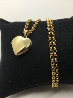 "14k Gold Heart locket Necklace  about 5.20 gr ,22\",2.5mm Priced to sell! Compare our prices to other similar sellers! Arrives in a GIFT BOX and includes FREE SHIPPING within the USA and Canada. International shipping is available at the most economical rates on ETSY. I HAVE BEEN IN THE JEWELRY BUSINESS ALL MY LIFE. I am a second -generation family member making gold and jewelry. Please feel free to ask me any questions - Always happy to help! Fast Replies to messages! Superior Quality and Best Prices!" Gold Heart Pendant Locket Necklace Stamped 14k, Oval Locket Necklace For Valentine's Day, Heart Pendant Locket Necklace Stamped 14k, 14k Gold Locket Necklace Gift, Classic Locket Necklace With Charms For Gift, 14k Gold Locket Necklace As Gift, 14k Gold Locket Necklace Stamped 14k For Gift, Gold Locket Necklace For Birthday Gift, Classic Heart Pendant Locket Necklace As A Gift