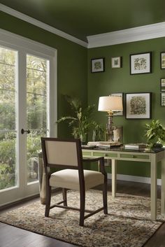 a home office with green walls and pictures on the wall above the desk, along with a white chair