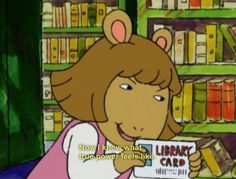 a cartoon girl holding up a library card in front of a bookshelf filled with books