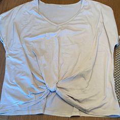 Perfect Condition! Never Worn Twist Top! Soft Material. Make A Bundle With My Other Stuff For The Best Deal! Cheap Faded Stonewashed Tops, Twist Top, Best Deal, Soft Material, Light Gray, Light Grey, Twist, Womens Tops, Tops & Tees