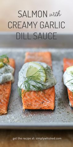 salmon with creamy garlic dill sauce on a baking sheet