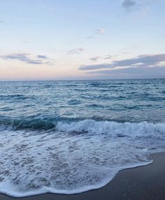 the ocean waves are coming in to shore