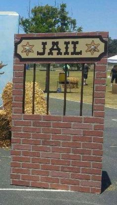 a brick sign that is in the shape of a jail cell with stars on it