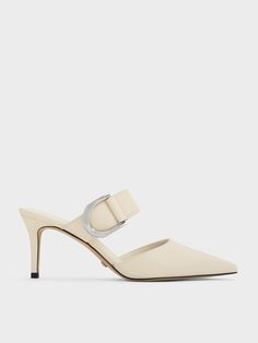 Elevate your footwear game with the Gabine leather mule pumps in chalk white. Enhanced by the iconic U-shaped buckles in subtle silver, these shoes will introduce an element of understated elegance into your everyday ensemble. Standing atop 7cm heels, they provide a noticeable boost in height while ensuring all-day comfort. These elegant pumps will seamlessly complement your existing assortment of Gabine bags and accessories. Mule Pumps, Elegant Pumps, Online Shopping Shoes, Quick Outfits, Size Chart For Kids, Chalk White, Charles Keith, Leather Mules, Understated Elegance