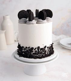 an oreo cookies and cream cake with white frosting