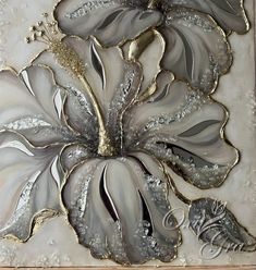 a painting with silver and white flowers on it