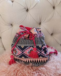 Gorgeous beaded tapestry details adorn this backpack. Designed with a tassel top cinch closure, adjustable backpack straps, a fully lined interior, and three inner pockets for storage. Not to small, but not to big... perfect for everyday use. Width: 14" Height: 12" Cheap Bohemian Multicolor Backpack, Pink Backpack For Vacation, Bohemian Pink Bucket Bag For Travel, Pink Bohemian Bucket Bag For Travel, Pink Bohemian Bucket Bag, Bohemian Woven Backpack For Daily Use, Bohemian Bucket Bag Backpack For Daily Use, Bohemian Backpack With Adjustable Strap For Festivals, Pink Tassel Bag For Travel