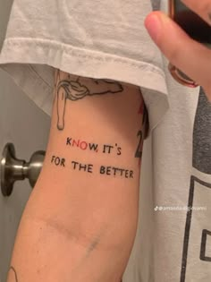 someone with a tattoo saying know it's for the better