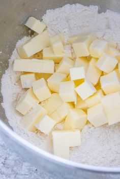 cubed butter and flour in a metal bowl