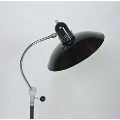 a black desk lamp on a white background