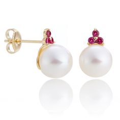 Made of yellow gold, these freshwater cultured pearl earrings are embellished with sparkling rubiess. Simple statements of elegance, pearls have been a mainstay in Gump's fine jewelry assortment for decades. Revered for their alluring luster and classic beauty, they are widely recognized as symbols of purity, integrity and wisdom gained through experience. To create these earrings, each pearl is carefully selected for quality, color and shape. Freshwater cultured pearls, 9mm. Rubies, 0.28ctw. 14 Red Pearl Earrings For Formal Occasions, Elegant White Ruby Earrings, Red Pearl Drop Earrings For Formal Occasions, Necklaces Colorful, William Yeoward Crystal, Bangle Ring, Jewelry By Material, Yellow Gold Earrings, Spring Jewelry