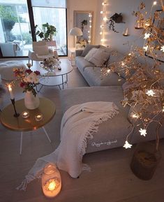 a living room filled with furniture and lights