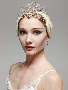 a woman with blonde hair wearing a tiara