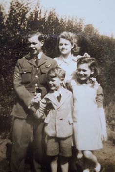 an old black and white photo of a family