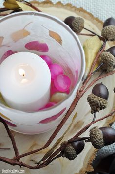 a candle that is sitting in a bowl